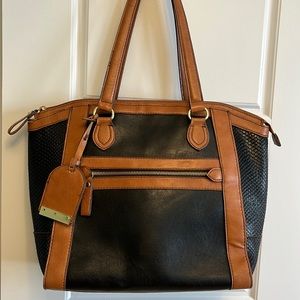 London Fog large black and tan simulated leather travel bag.